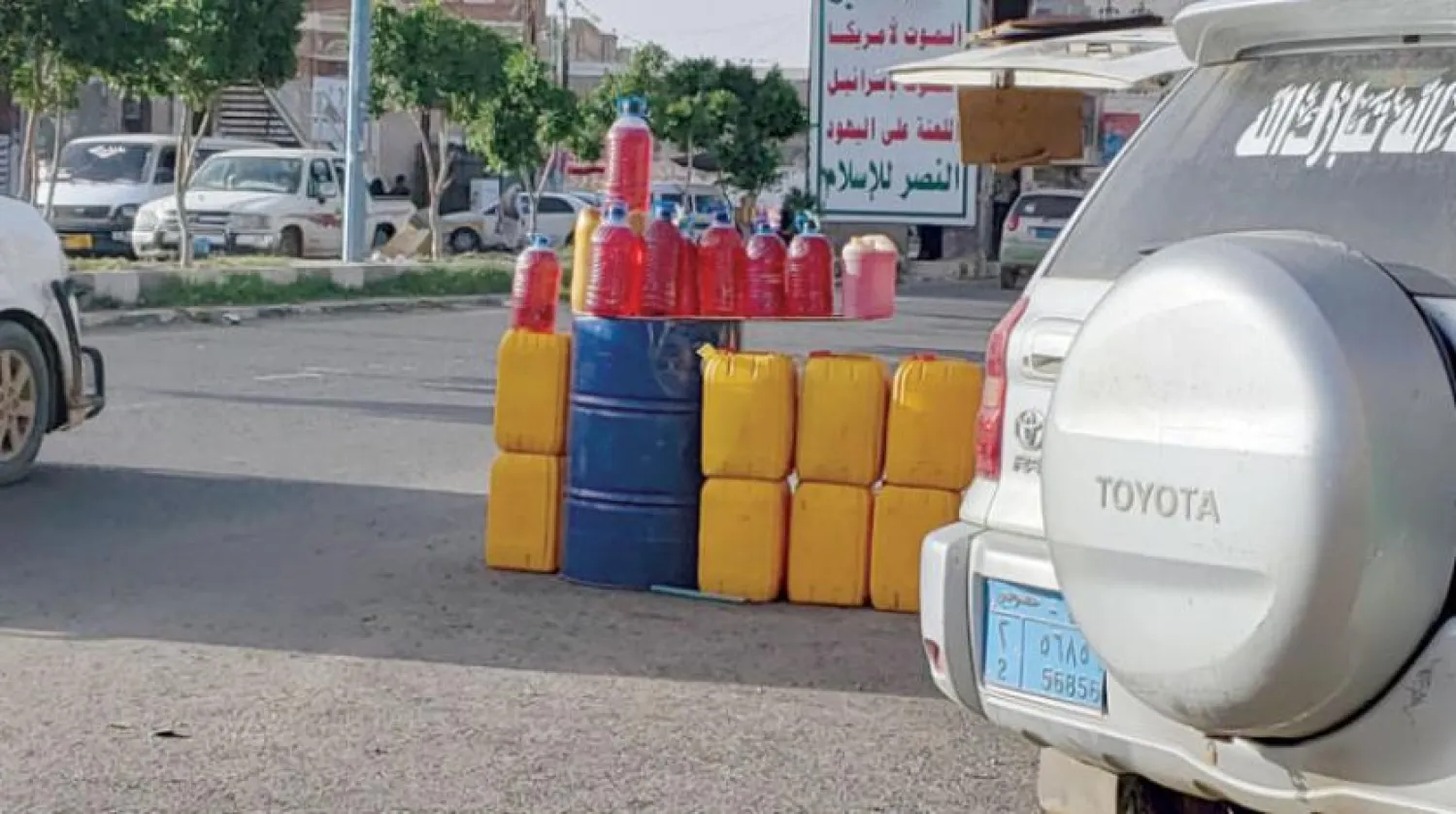 Fuel sold in Sanaa via street vendors (EPA)

