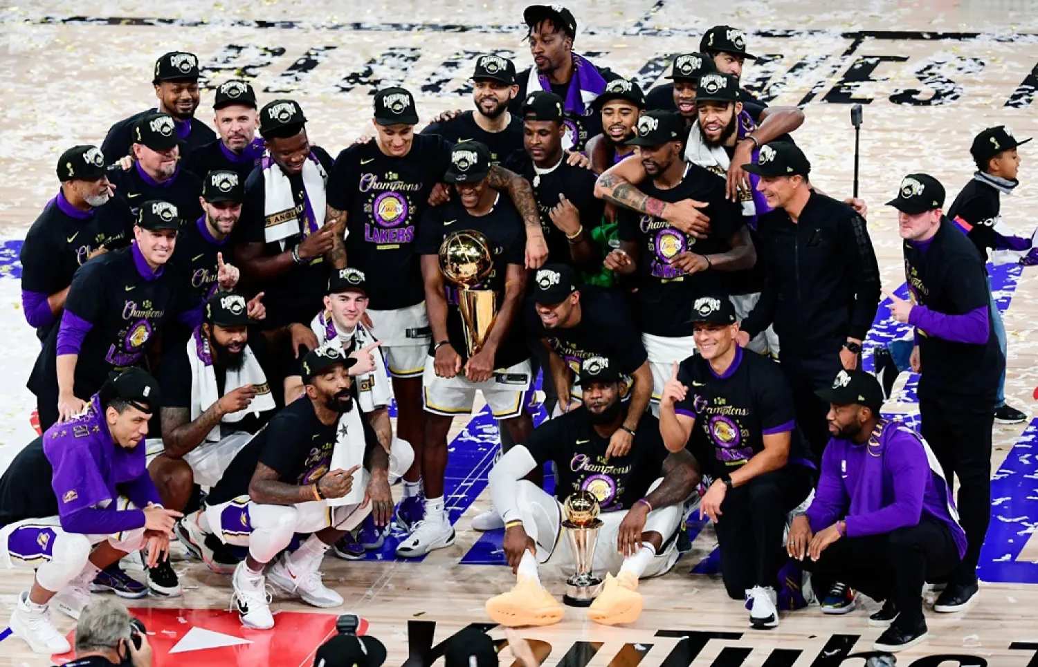 The Los Angeles Lakers pose for a team photo with the trophy after winning the 2020 NBA Championship on Sunday. (Getty Images)