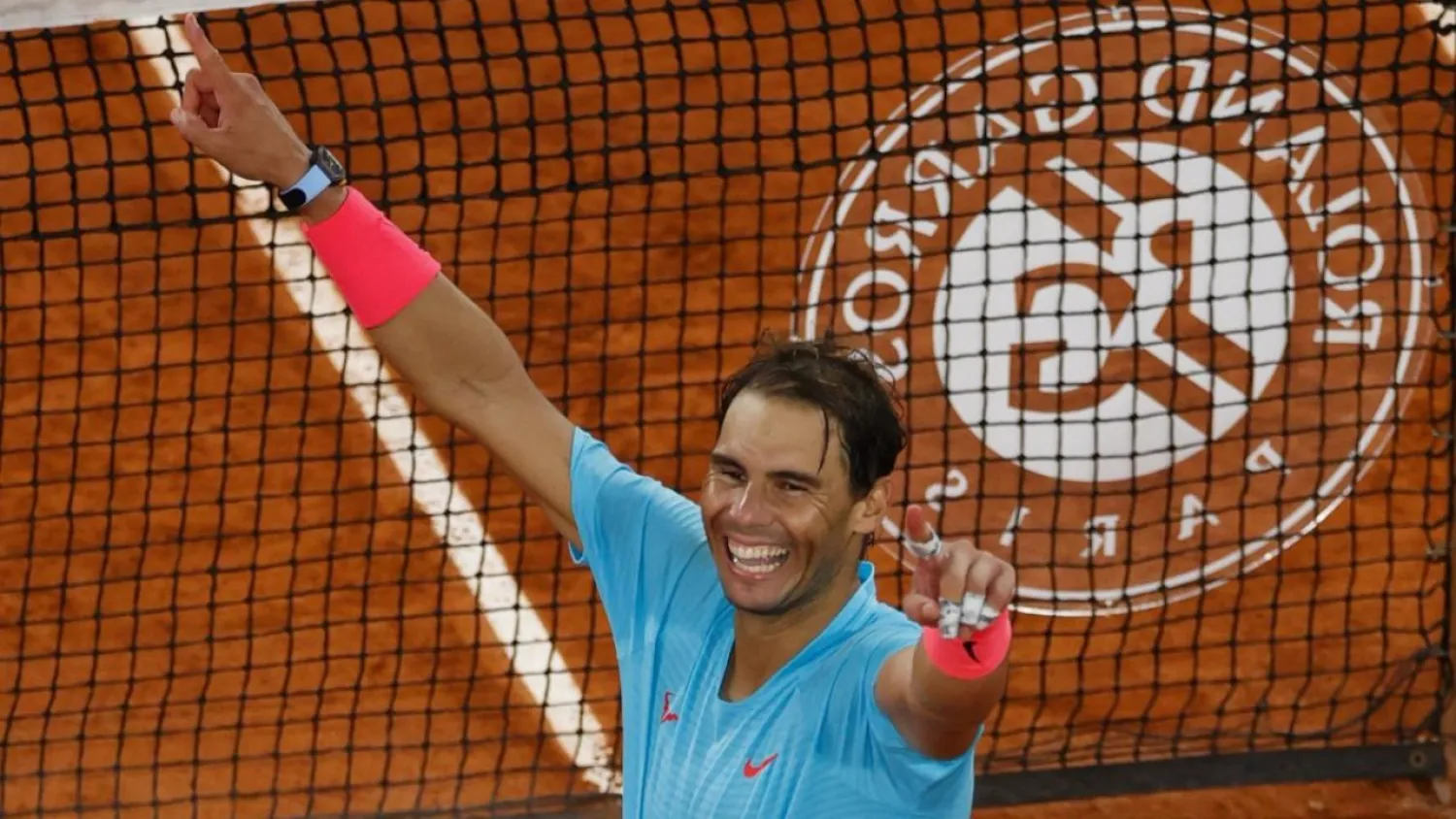 Rafael Nadal celebrates after winning against Serbia's Novak Djokovic to claim a record 13th Roland Garros title. (AFP)