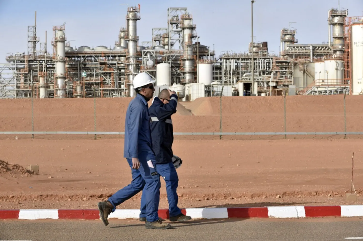 Two orkers seen walking at the gas plant in In Amenas, Algeria on January 16, 2018. (Getty Images)