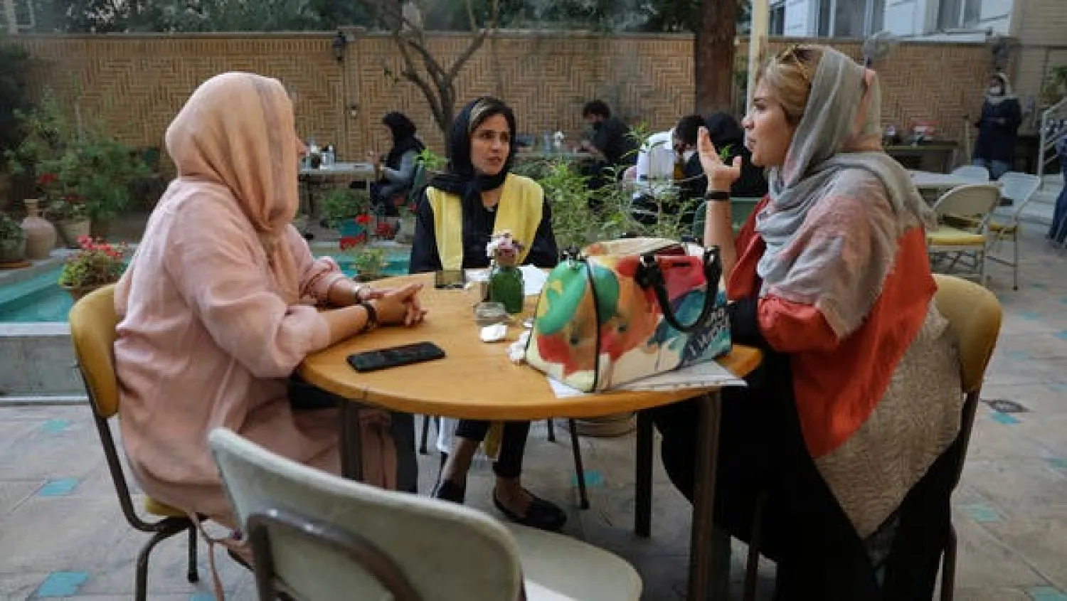 People spend their afternoon in a cafe in Tehran, Iran, Sunday, Sept. 20, 2020. AP