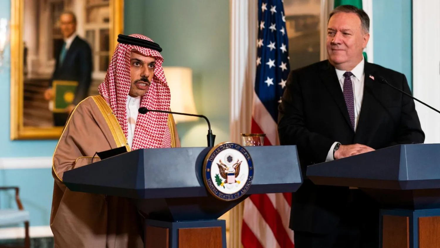 Secretary of State Mike Pompeo, right, listens to Saudi Minister of Foreign Affairs Prince Faisal bin Farhan Al Saud at the State Department, Wednesday, Oct. 14, 2020, in Washington. (AP Photo/Manuel Balce Ceneta, POOL)