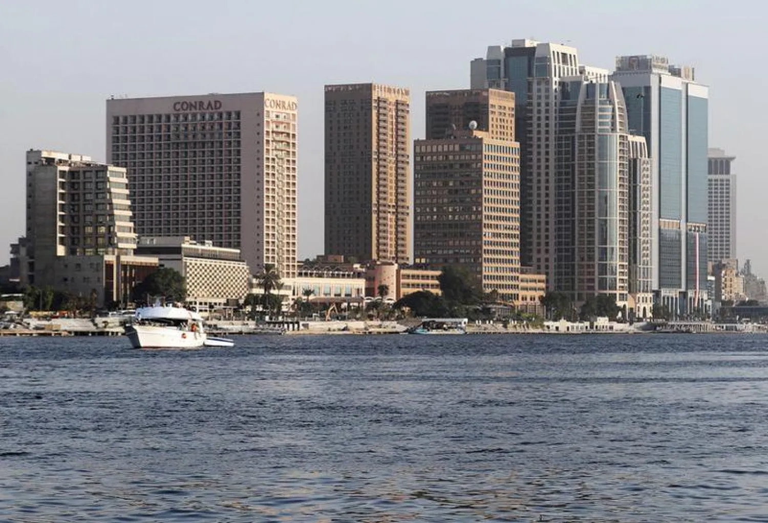 FILE PHOTO: A boat travels along the hotels, banks and office buildings on the Nile River in Cairo, Egypt October 9, 2020. REUTERS/Mohamed Abd El Ghany/File Photo