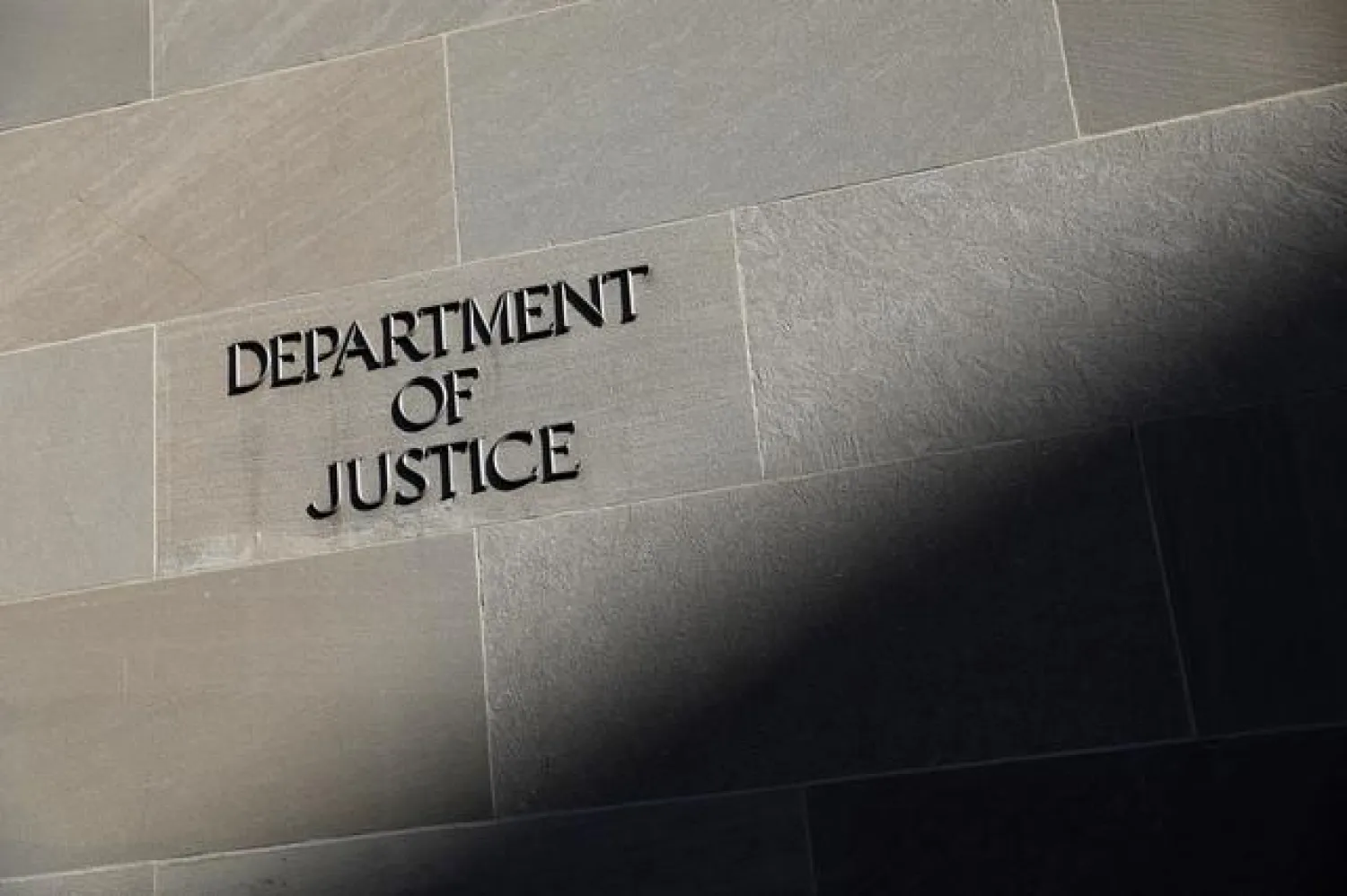 FILE PHOTO: Signage is seen at the United States Department of Justice headquarters in Washington, DC, US, August 29, 2020. REUTERS/Andrew Kelly