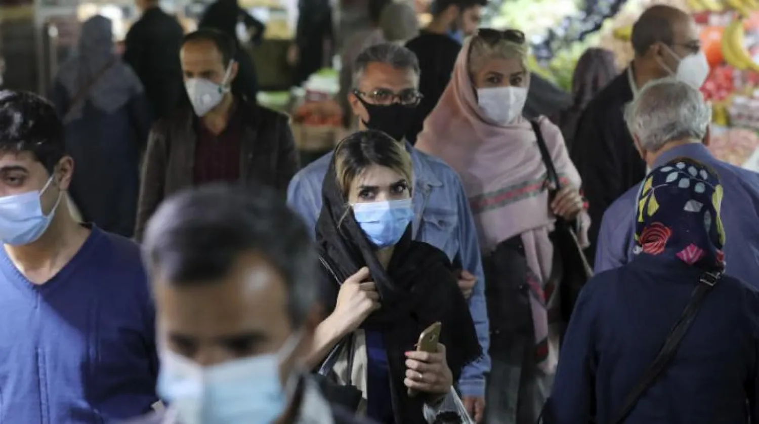 People wear protective face masks to help prevent the spread of the coronavirus in the Tajrish traditional bazaar in northern Tehran, Iran, Thursday, Oct. 15, 2020. (AP Photo/Ebrahim Noroozi)