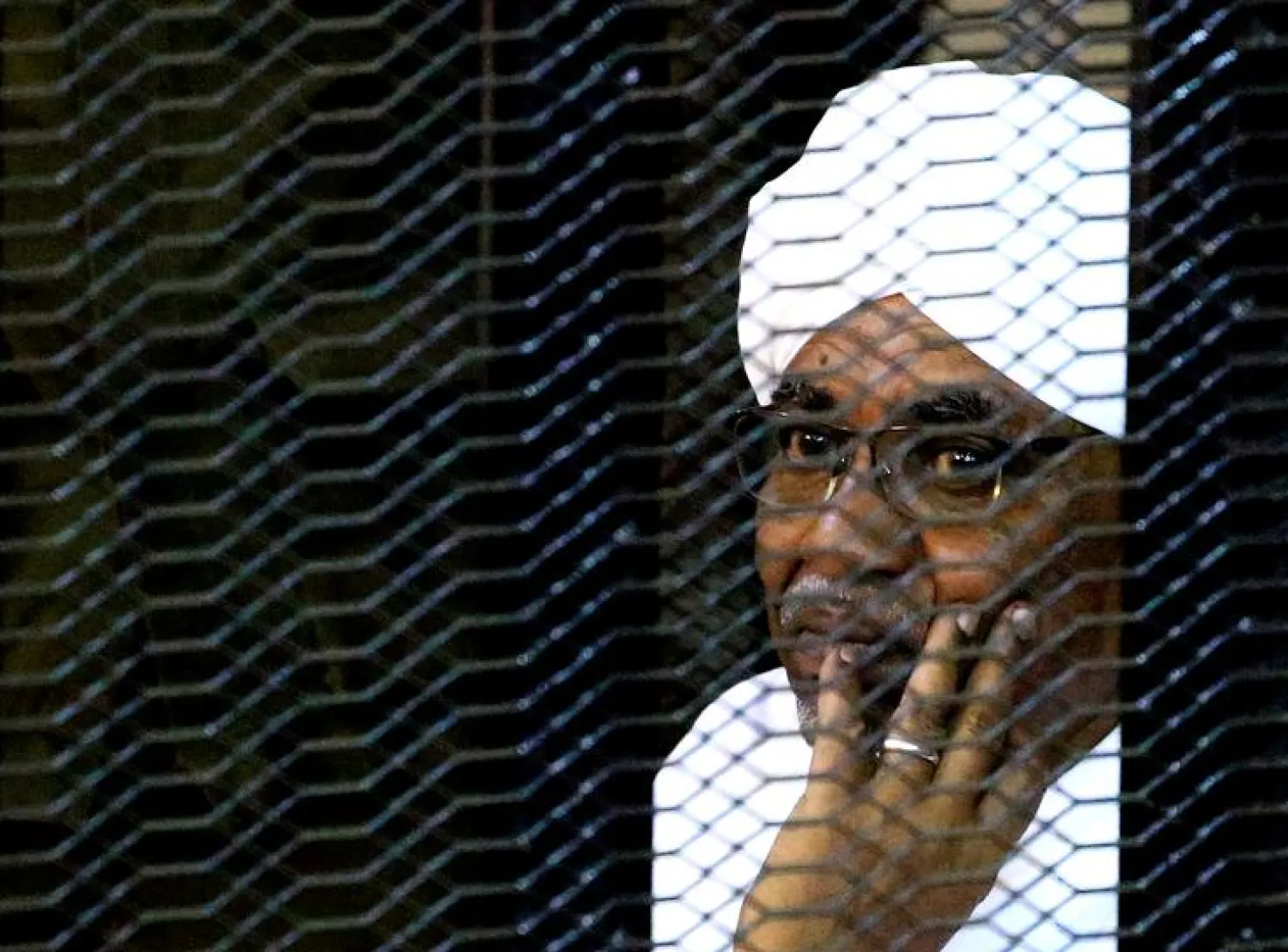 Sudan's ousted president Omar al-Bashir sits inside a cage at the courthouse where he is facing corruption charges, in Khartoum, Sudan September 28, 2019. REUTERS/Mohamed Nureldin Abdallah
