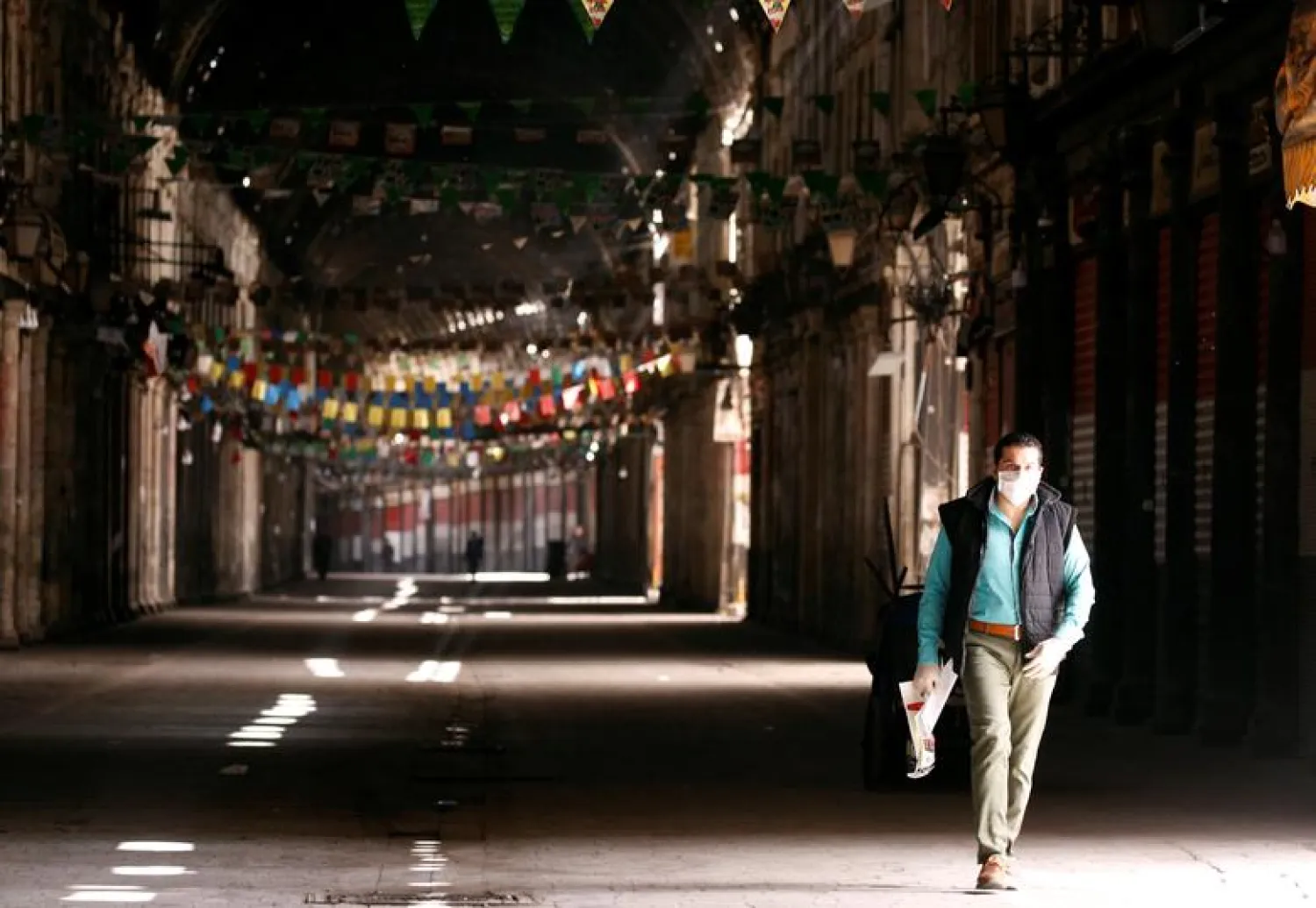 A man walks in empty Souk al-Hamidieh as restrictions are imposed as measure to prevent the spread of the coronavirus disease (COVID-19) in Damascus, Syria (Reuters)
