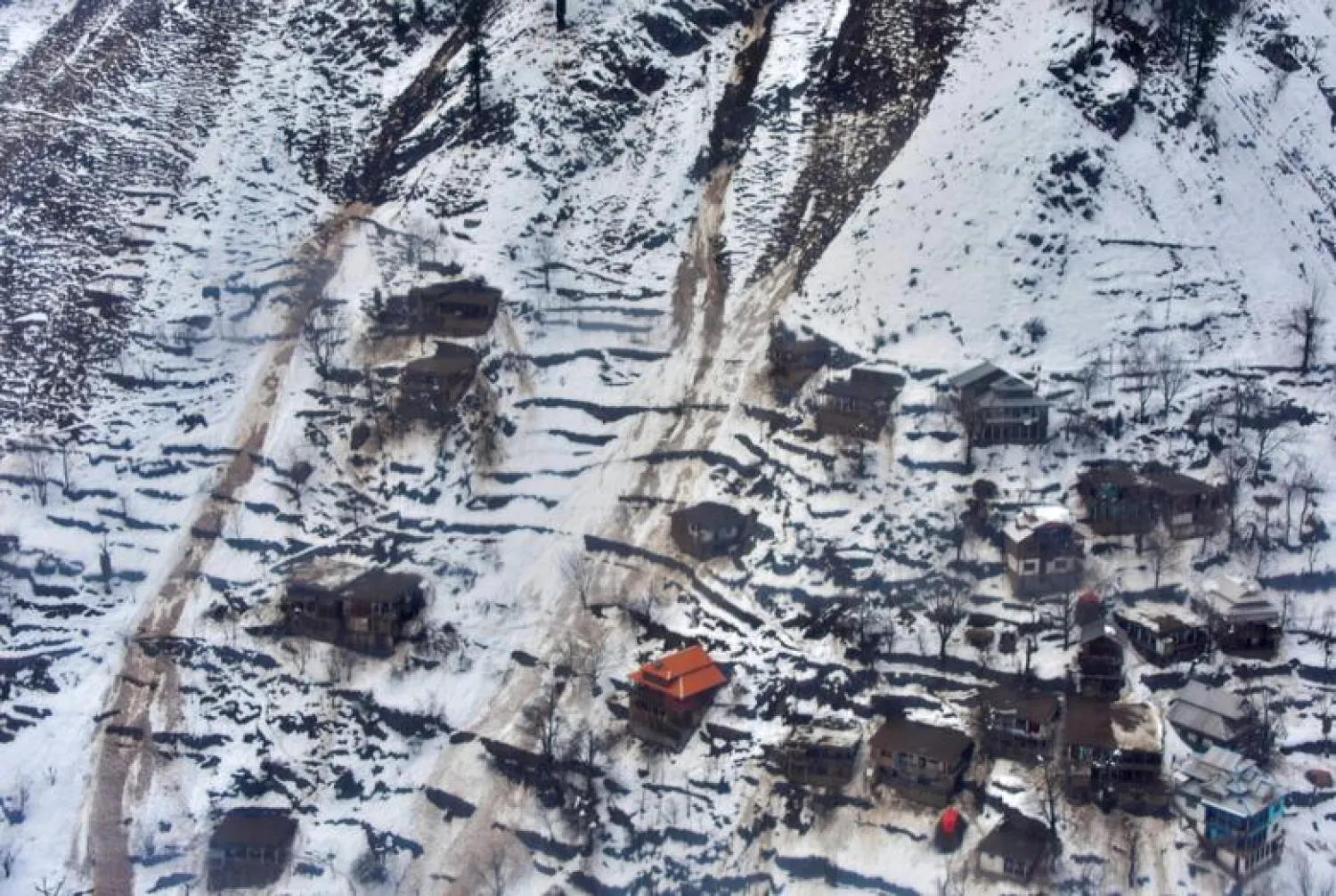 General view of a residential area with snow-covered mountains after a heavy snowfall in Neelum Valley near line of control (LoC), Pakistan, January 16, 2020. REUTERS/Stringer

