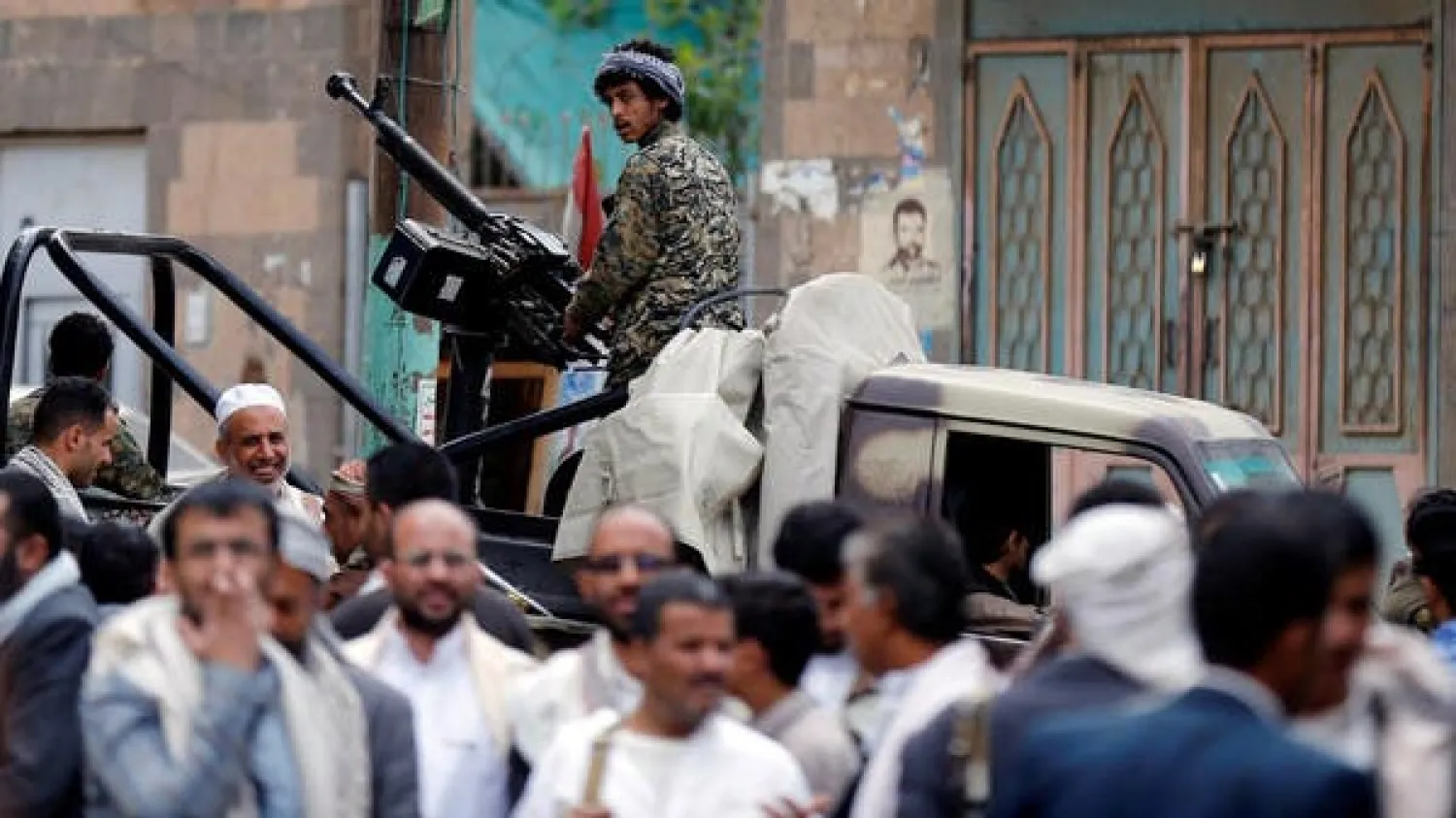 A Houthi militant mans a machine gun mounted on a patrol truck in Sanaa, Yemen (Reuters)
