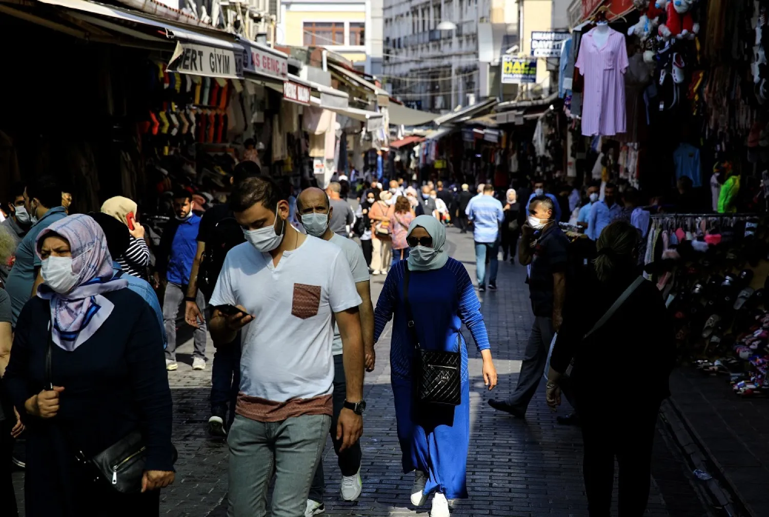 People wearing masks walk on a street in Eminönü district, in Istanbul, Turkey, Sept. 24, 2020. (Reuters)