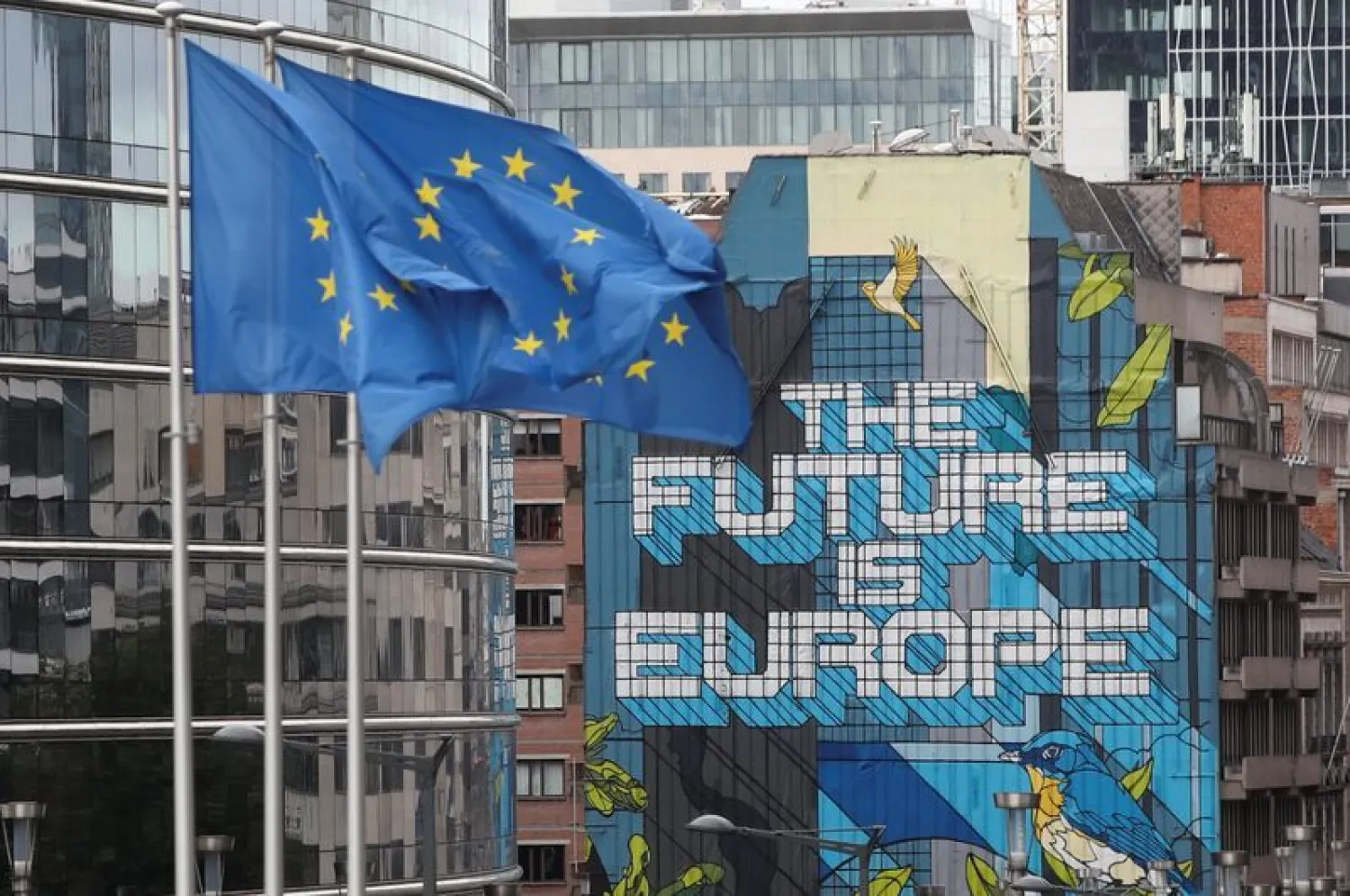 European Union's flags flutter outside the European Commission headquarters in Brussels, Belgium October 15, 2020. REUTERS/Yves Herman