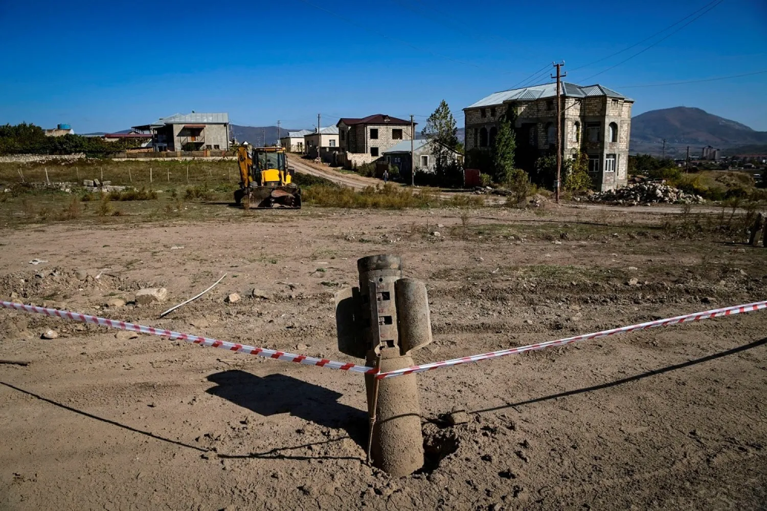 An unexploded BM-30 Smerch missile is seen on the outskirts of Stepanakert, a main city in Nagorno-Karabakh, on October 12, 2020. (AFP)
