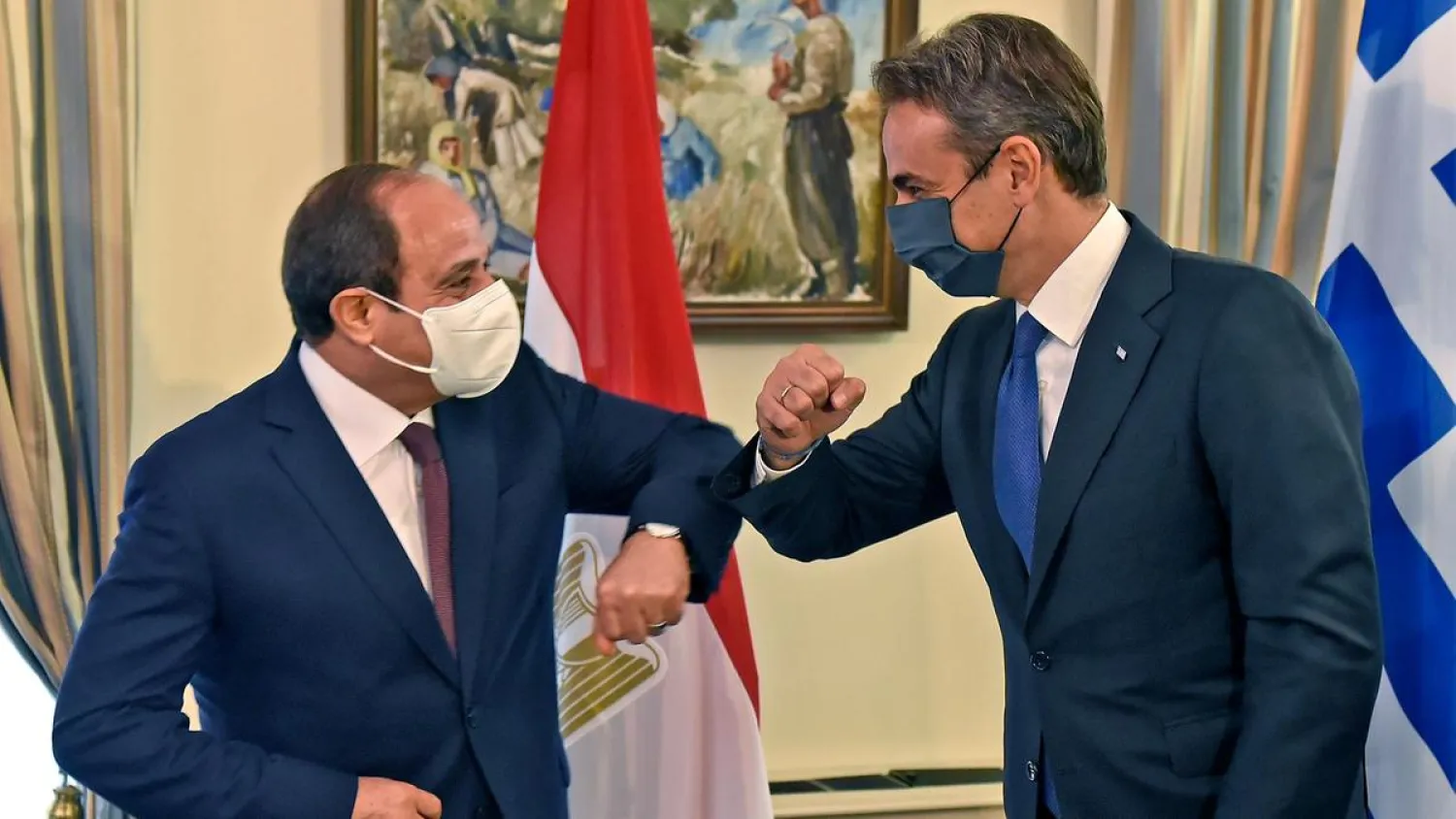 Egyptian President Sisi shares an elbow bump with Greek Prime Minister Kyriakos Mitsotakis as they meet at the presidential palace in Nicosia, Cyprus. (EPA)