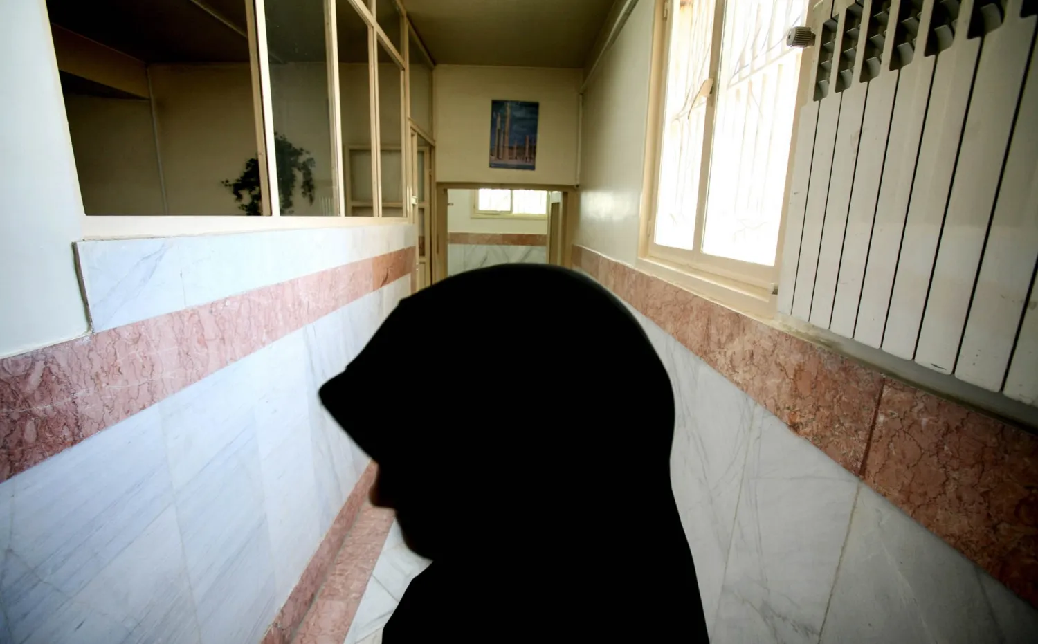 A female prison guard stands in a corridor in Tehran's Evin Prison in 2006. Morteza Nikoubaz/Reuters