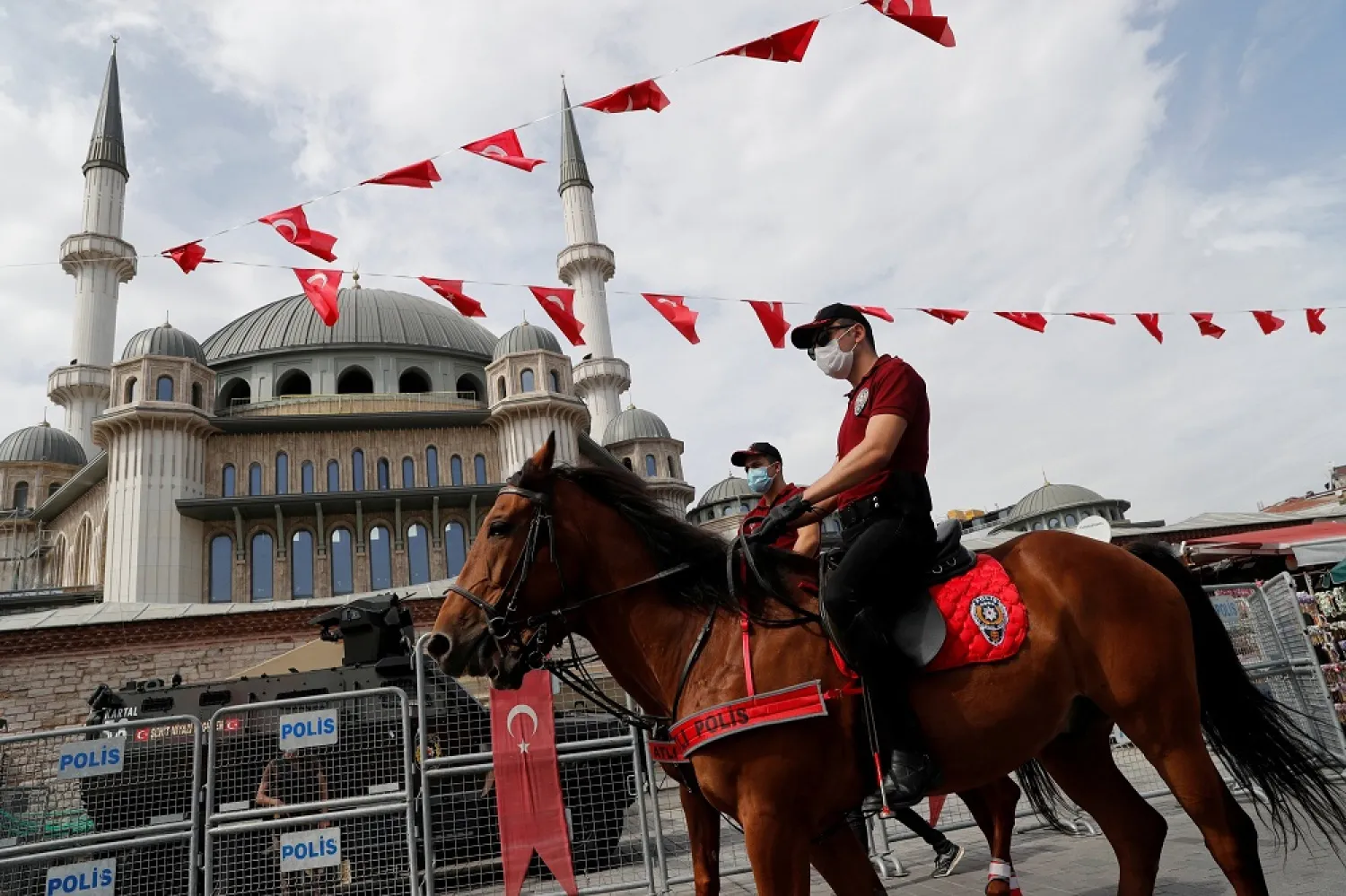 Members of Istanbul Police Department Mounted Unit patrol against people not wearing protective face masks at Taksim Square, in Istanbul, Turkey September 26, 2020. (Reuters)