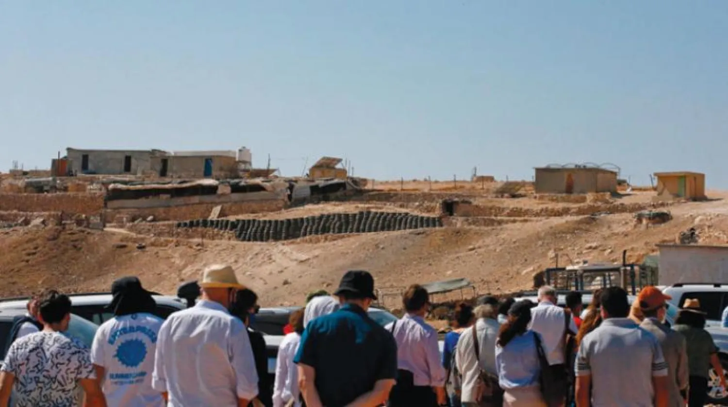 European missions and human rights organizations visit a hill, south of Hebron, which Israel considers a military zone (AFP)