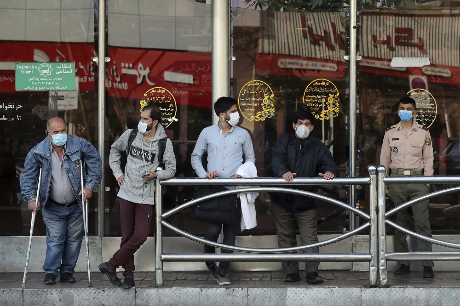 People wear protective face masks to help prevent the spread of the coronavirus in downtown Tehran, Iran, October 11, 2020. (AP)