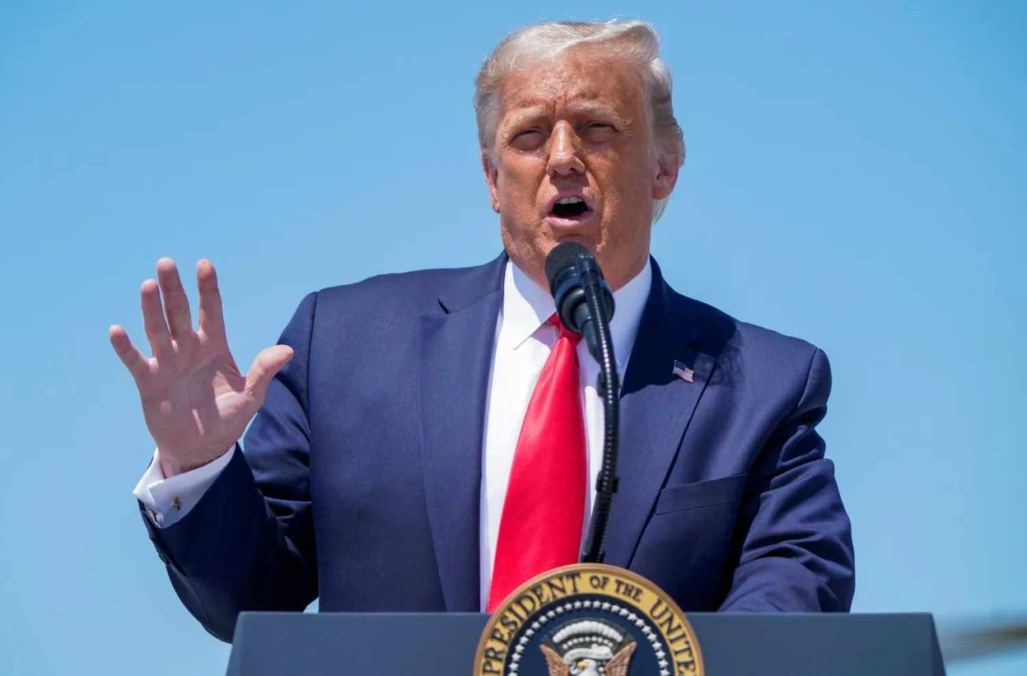 U.S. President Donald Trump addresses supporters gathered to greet him on the airport tarmac during his arrival at Burke Lakefront Airport in Cleveland, Ohio, US, August 6, 2020. REUTERS/Joshua Roberts