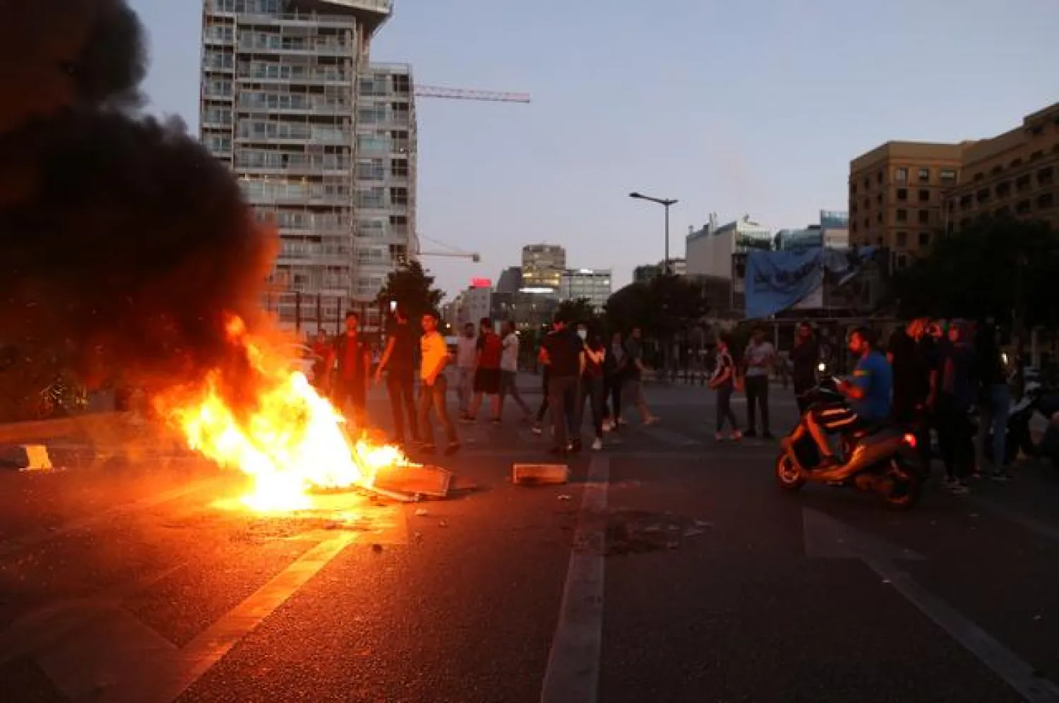Demonstrators set fire during a protest against the collapsing Lebanese currency, in Beirut, Lebanon June 11, 2020. REUTERS/Issam Abdallah