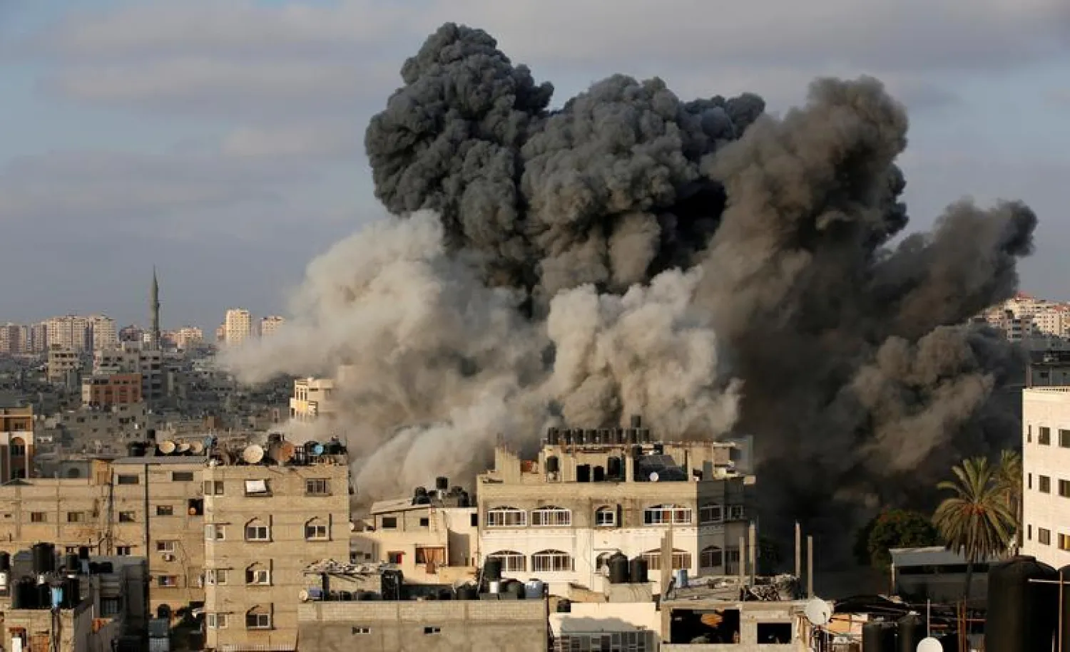 Smoke rises after an Israeli aircraft bombed a multi-storey building in Gaza. Reuters file photo
