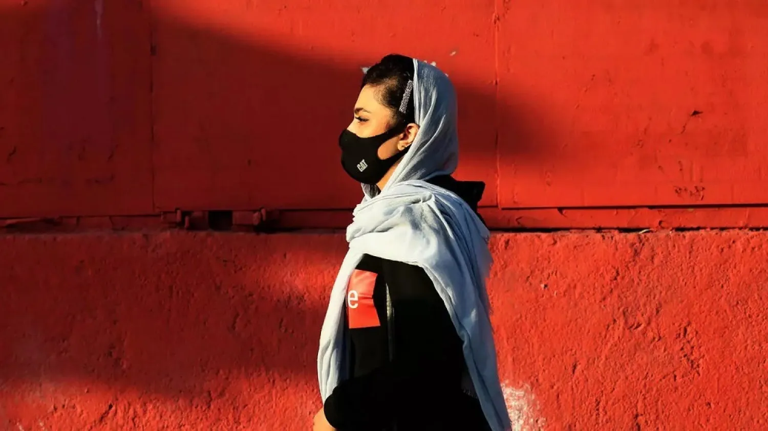An Iranian woman wears a face mask as a COVID-19 coronavirus pandemic precaution in Iran's capital Tehran. (AFP)