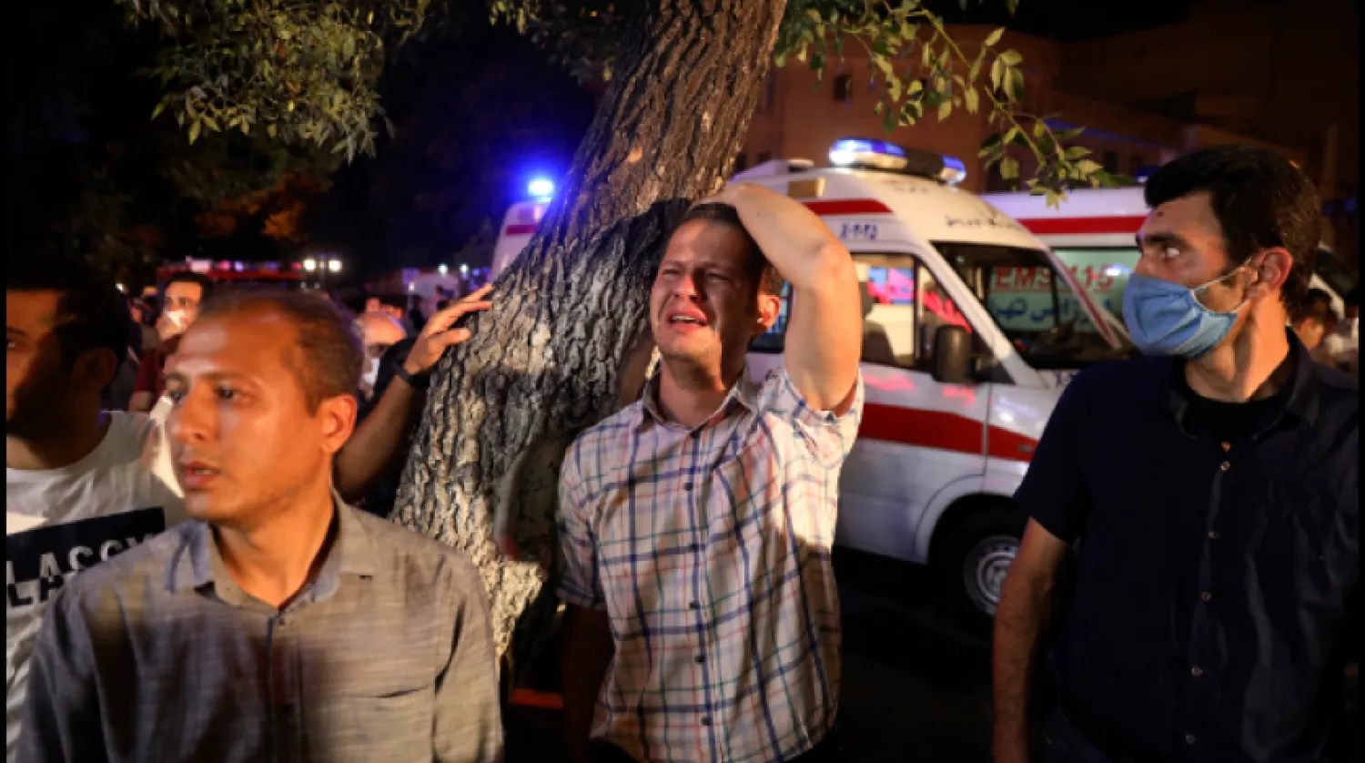 A man whose relative is on staff at Sina Athar Clinic weeps after its explosion, outside the clinic in Tehran, Iran, early Wednesday, July 1, 2020. - AP
