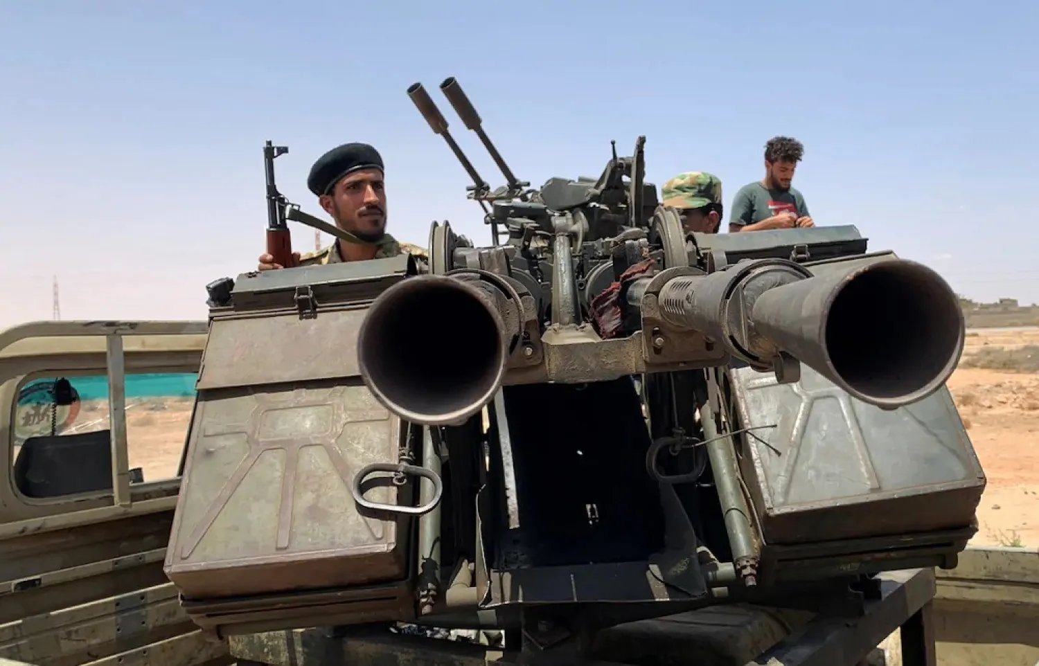 A member of the troops loyal to the GNA rides a military vehicle as he prepares before heading to Sirte, on the outskirts of Misrata, on July 18. (Reuters)