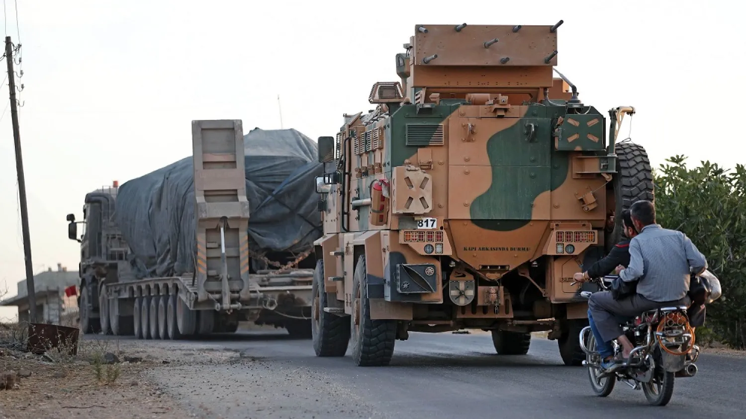 A Turkish military convoy drives through the village of Iblin near Ariha in Syria's Idlib on Oct. 20, 2020, after vacating the Morek post in Hama's countryside. (Getty Images)