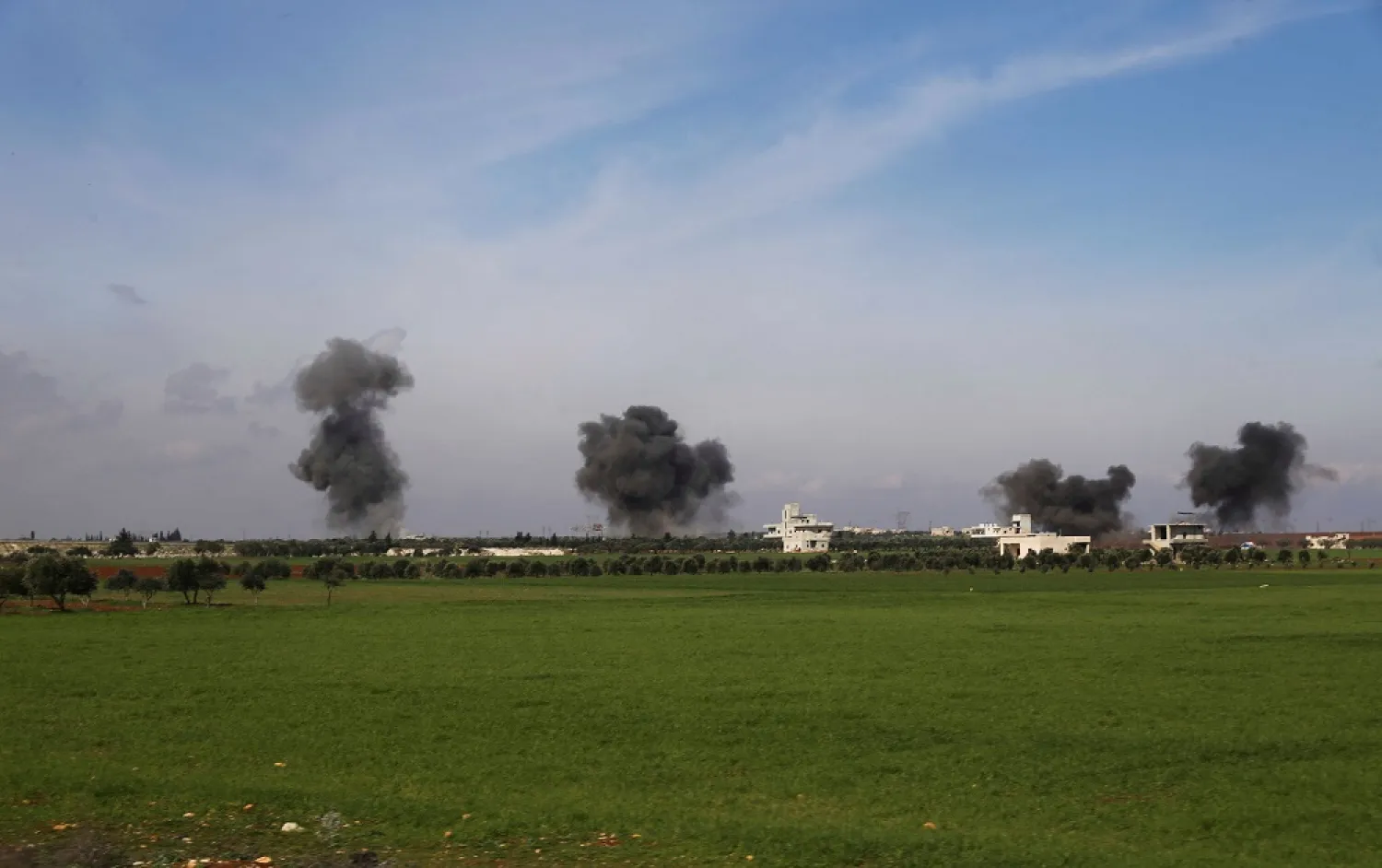 Columns of smoke raise after air strikes hit the town of Saraqeb, in Idlib province, Syria, Feb. 27, 2020. (AP)