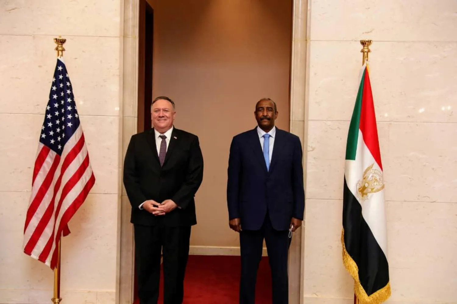 US Secretary of State Mike Pompeo poses for a picture with the head of Sudan’s Transitional Sovereignty Council, Abdel Fattah al-Burhan, Sudan, August 25, 2020. (Handout via Reuters)