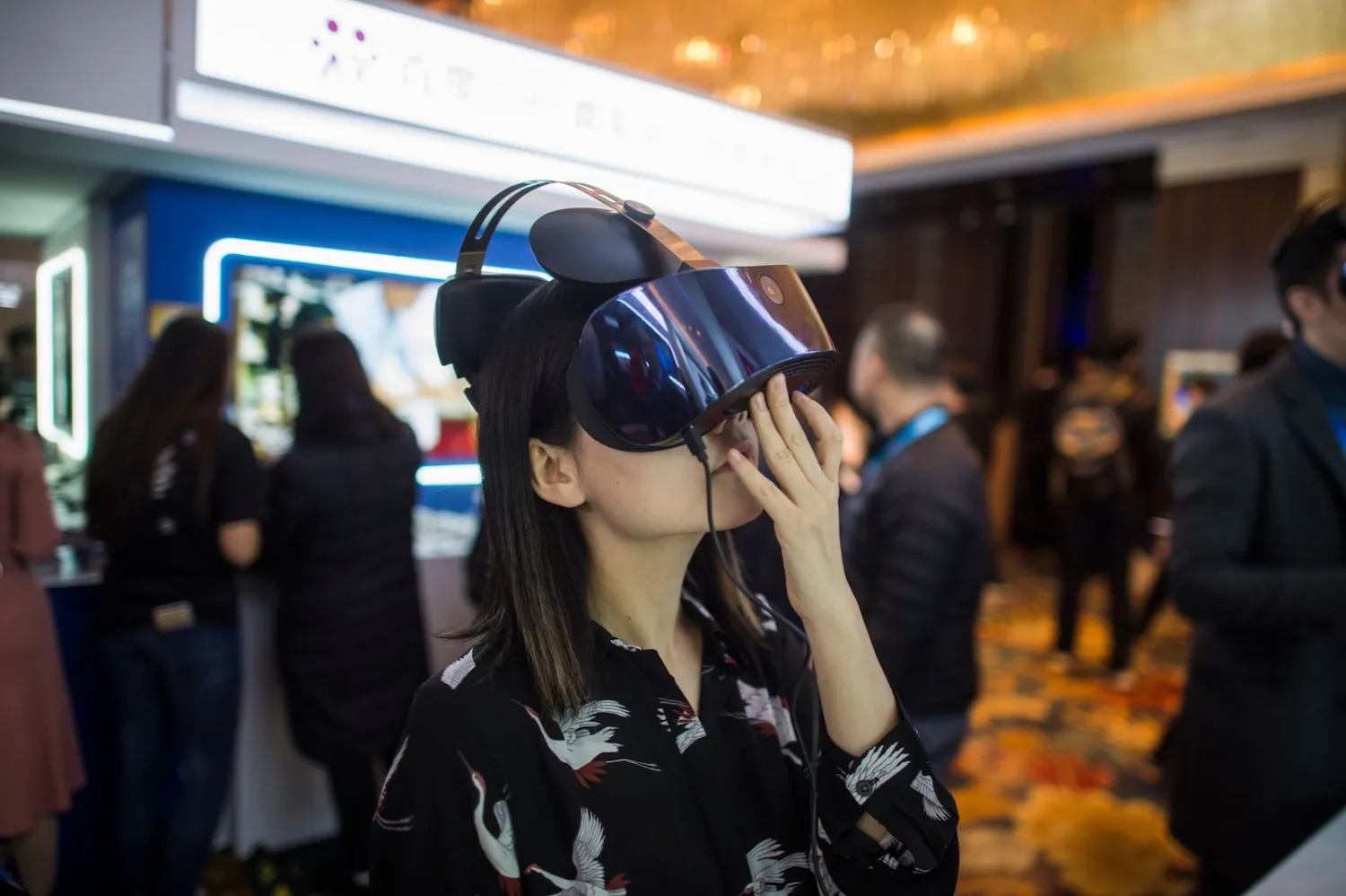 A visitor uses virtual reality goggles at the annual Baidu
World Technology Conference in Beijing. Photo: Fred Dufour/AFP/Getty
Images