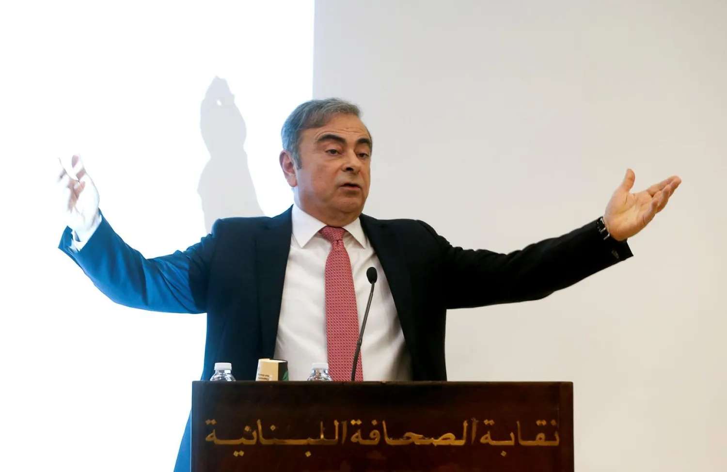 Former Nissan chairman Carlos Ghosn gestures as he speaks during a news conference at the Lebanese Press Syndicate in Beirut, Lebanon January 8, 2020. REUTERS/Mohamed Azakir