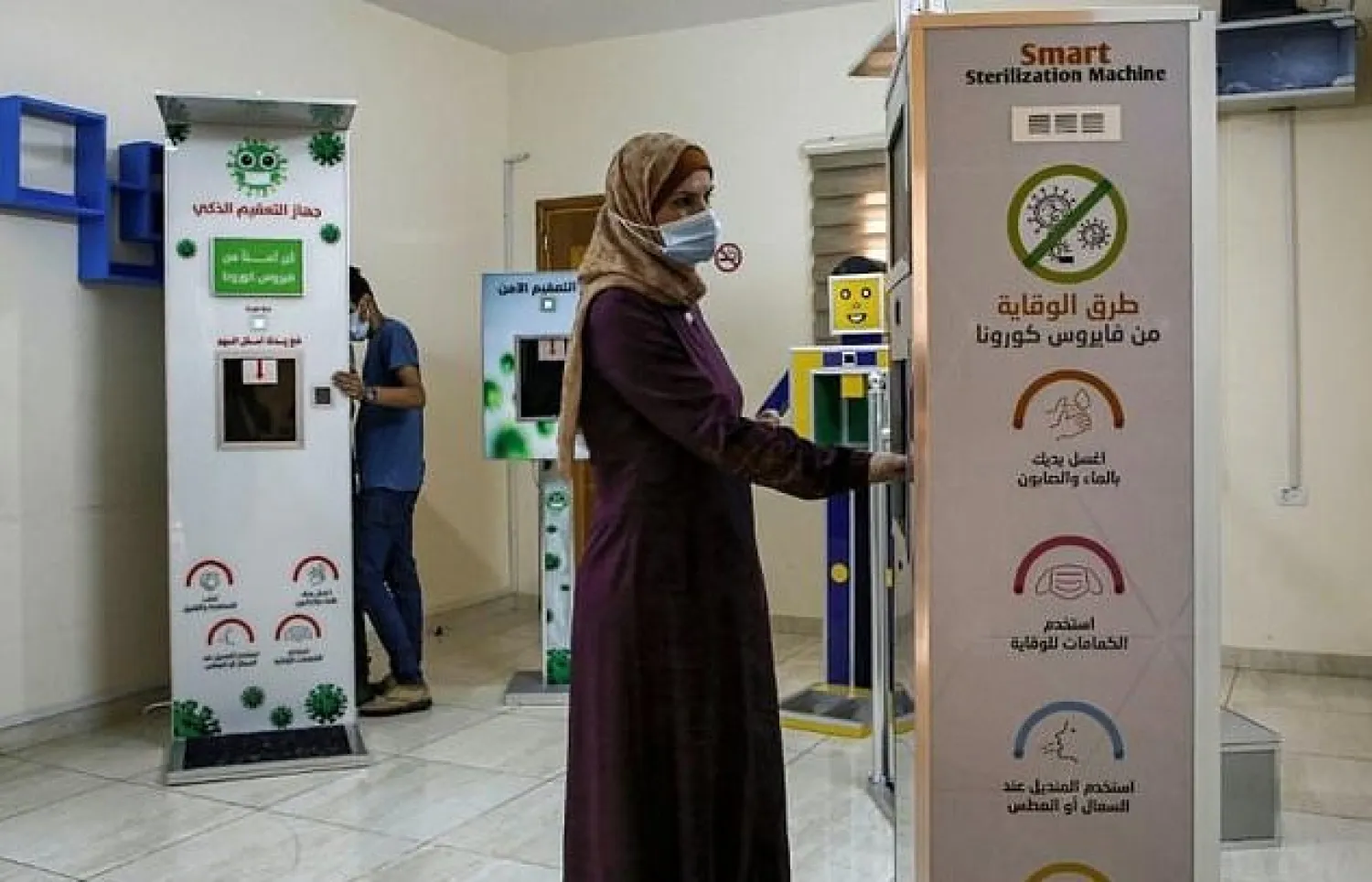 Palestinian entrepreneur Heba al-Hindi demonstrates a locally-designed and manufactured sterilisation device in Gaza City. AFP


