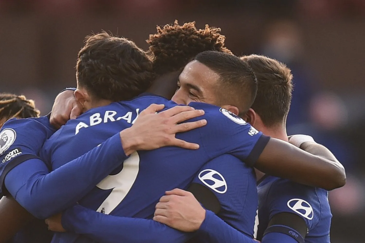 Chelsea players celebrate with Hakim Ziyech, center right, after he scored his side's opening goal during an English Premier League match against Burnley at the Turf Moor stadium, Oct. 31, 2020. (AP)