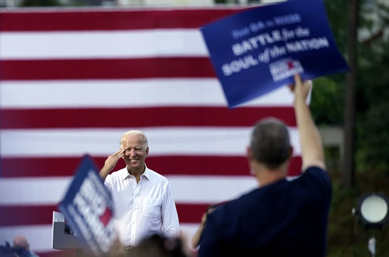 Democratic presidential candidate former Vice President Joe Biden greets supporters at a drive-in rally at Cellairis Amphitheatre in Atlanta, Oct. 27, 2020. (AP)