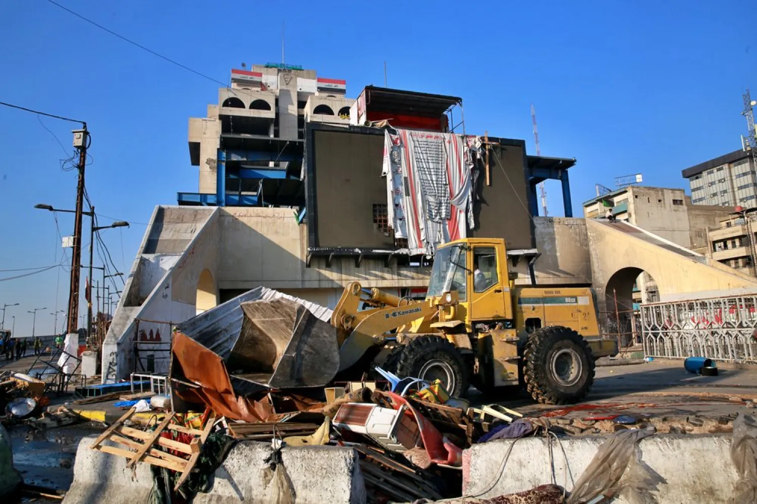 Security forces remove anti-government protesters' tents at protesters' site in Tahrir Square, Baghdad, Iraq, Oct. 31, 2020. (AP)