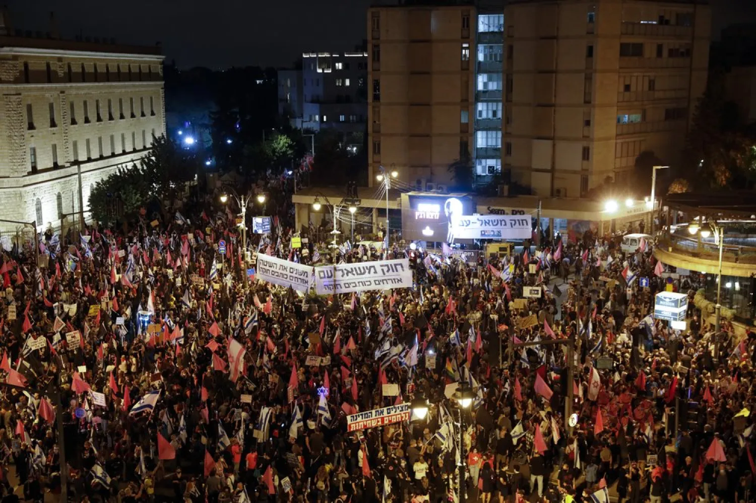 Protesters chant slogans and hold signs during a protest against Israel's Prime Minister Benjamin Netanyahu in Jerusalem, Saturday, Oct. 31, 2020 - (AP Photo/Ariel Schalit)
