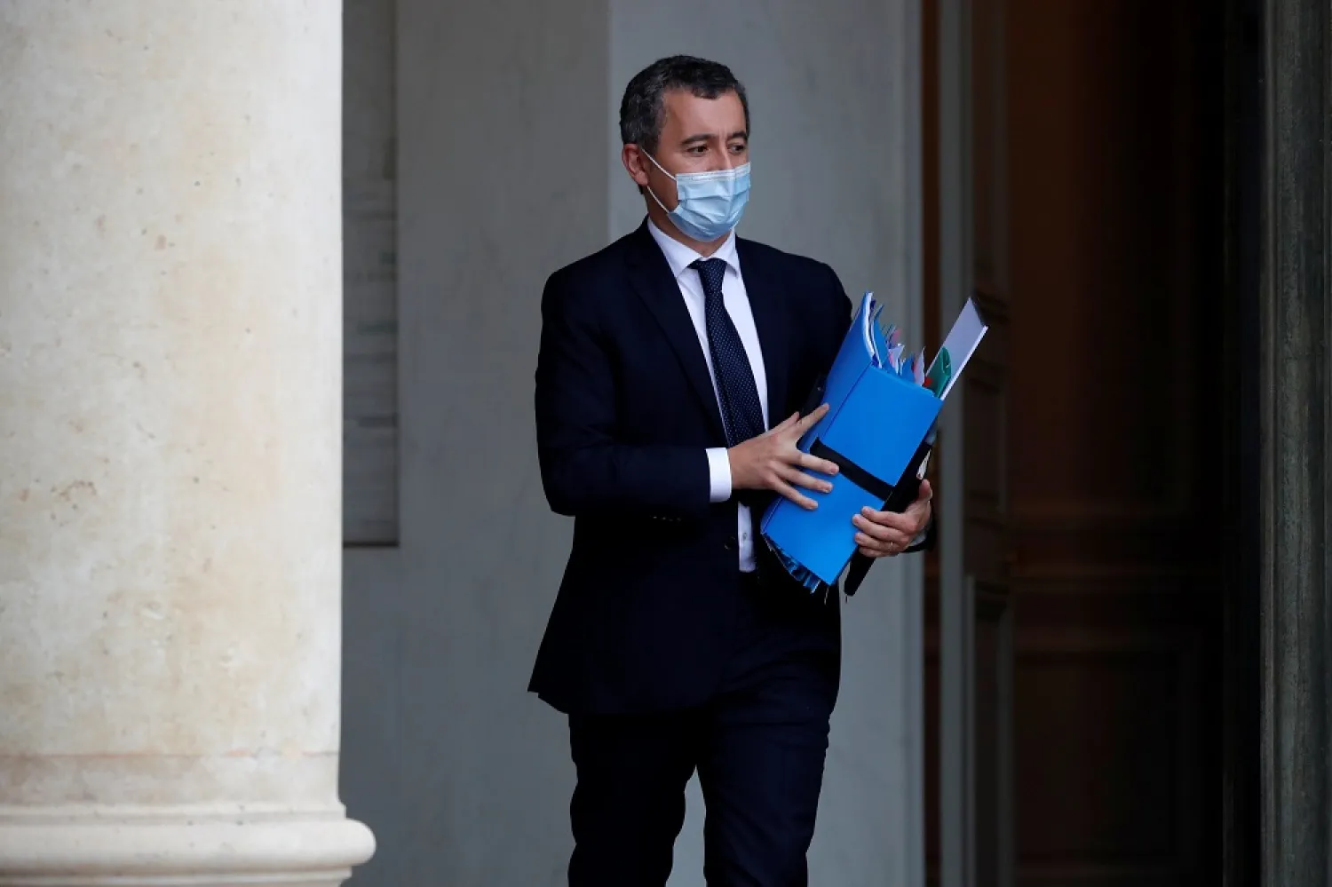 French Interior Minister Gerald Darmanin, wearing a protective mask, leaves following the weekly Cabinet meeting at the Elysee Palace in Paris, France, Oct. 28, 2020. (Reuters)