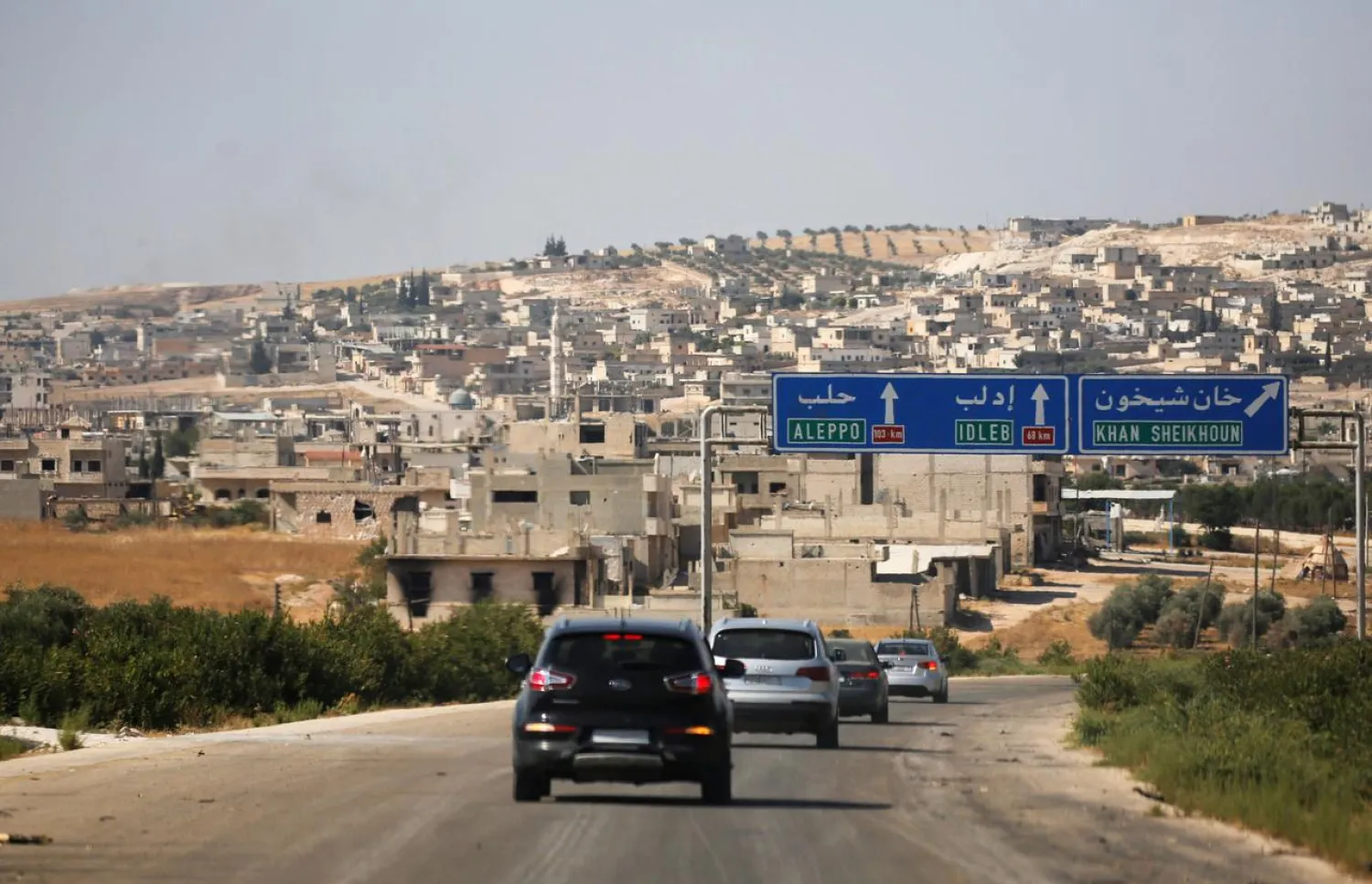 A journalists' convoy is seen at the entrance of Khan Sheikhoun, Idlib, Syria August 24, 2019. REUTERS/Omar Sanadiki