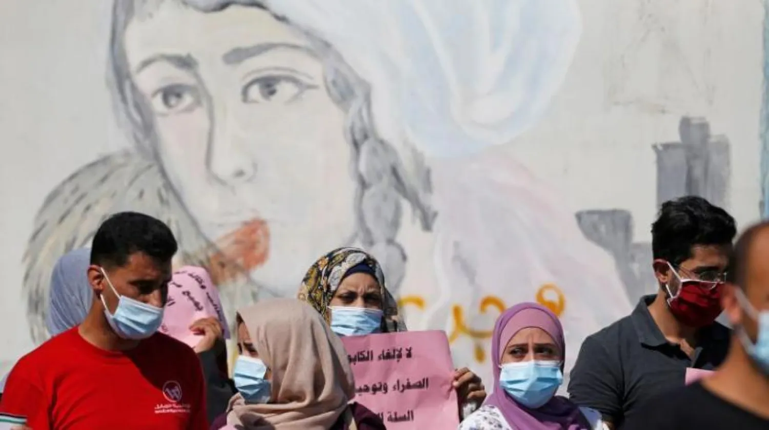 Gazze Şeridi’nde maske takan Filistinliler (AFP)