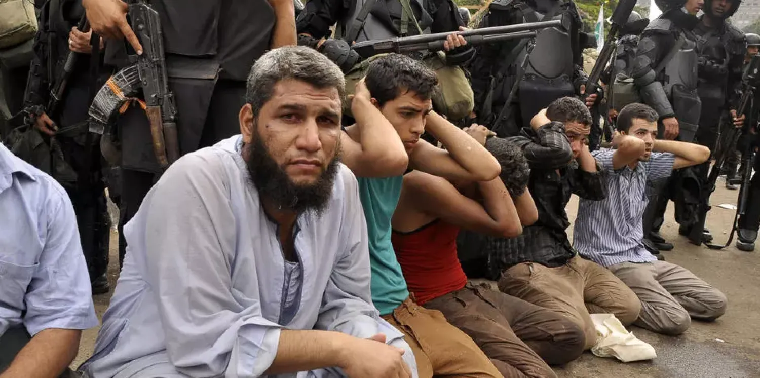 Egyptian security forces round up suspected protesters after a deadly 2013 operation to disperse a six-week sit-in in the capital's Rabaa al-Adaweya Square Engy Imad ENGY IMAD/AFP/File
