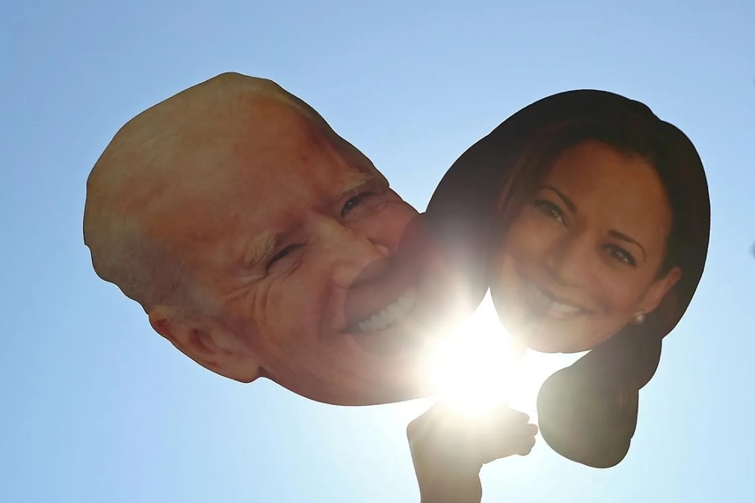 Cardboard cut-outs of Joe Biden and Kamala Harris are seen as people celebrate at Black Lives Matter Plaza after Biden won the presidential election, in Washington, November 7, 2020. (Reuters)