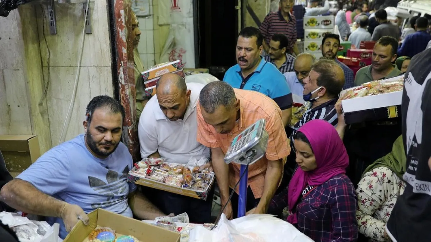 Egyptians shop at a street market in Cairo. (Reuters)
