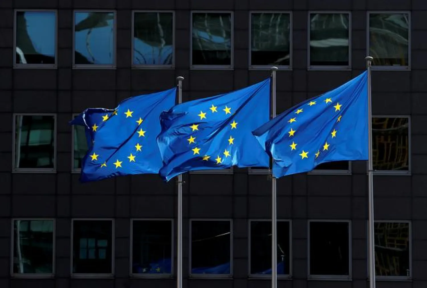 FILE PHOTO: European Union flags flutter outside the European Commission headquarters in Brussels, Belgium August 21, 2020. REUTERS/Yves Herman

