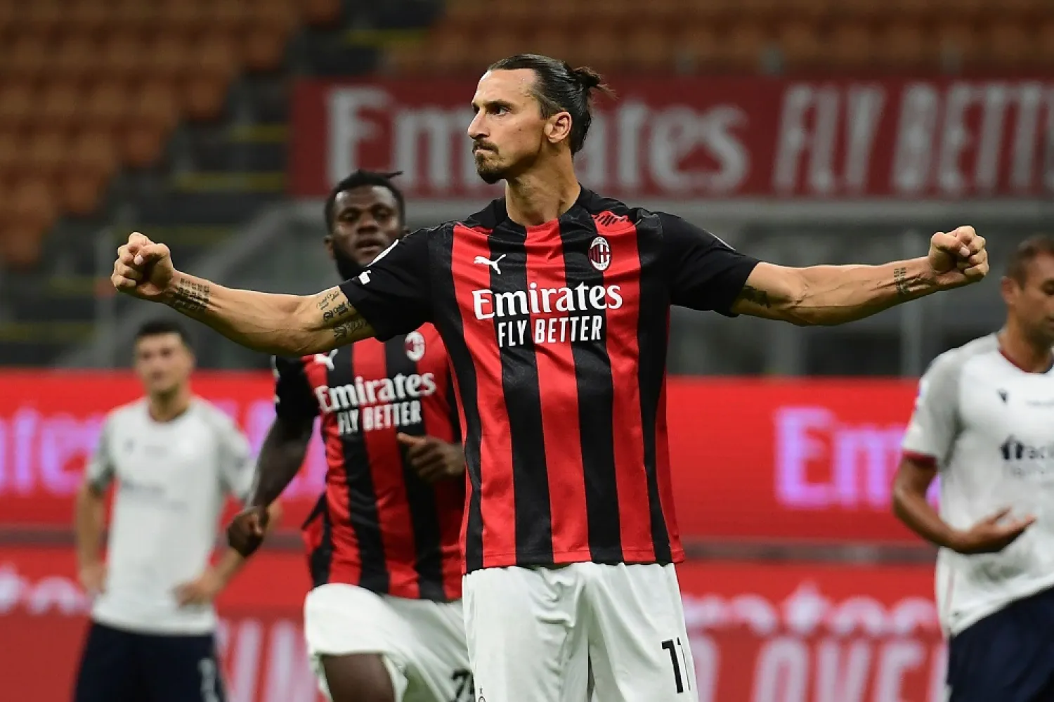 Zlatan Ibrahimovic celebrates after scoring a goal against Bologne, in Milan, Italy, Sept. 21, 2020. (AFP)