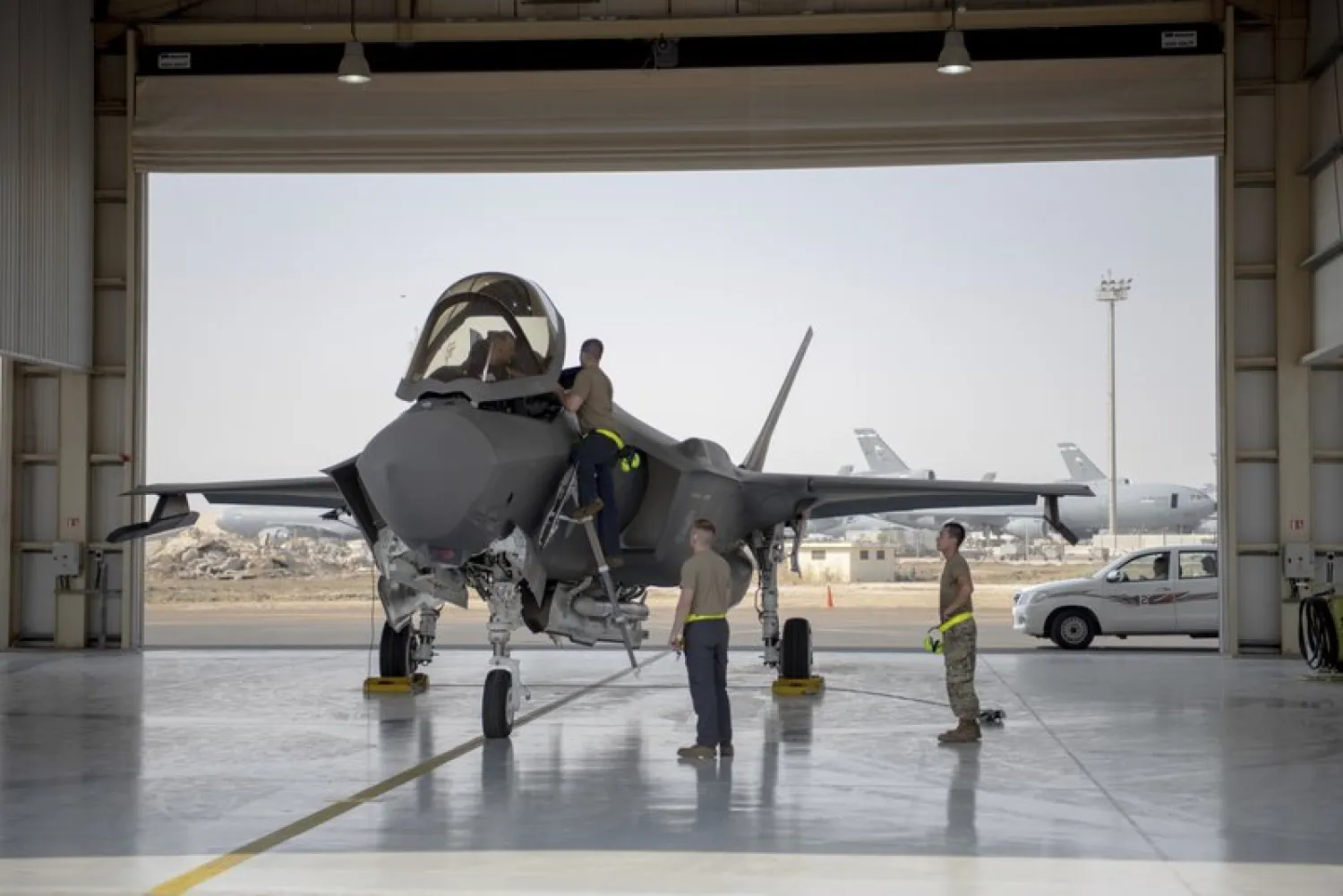 In this Aug. 5, 2019, photo released by the U.S. Air Force, an F-35 fighter jet pilot and crew prepare for a mission at Al-Dhafra Air Base in the United Arab Emirates (Staff Sgt. Chris Thornbury/U.S. Air Force via AP)
