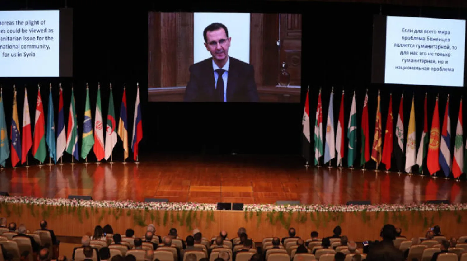 الأسد يلقي كلمة عبر الفيديو في افتتاح مؤتمر اللاجئين السوريين في دمشق أمس (أ.ف.ب)