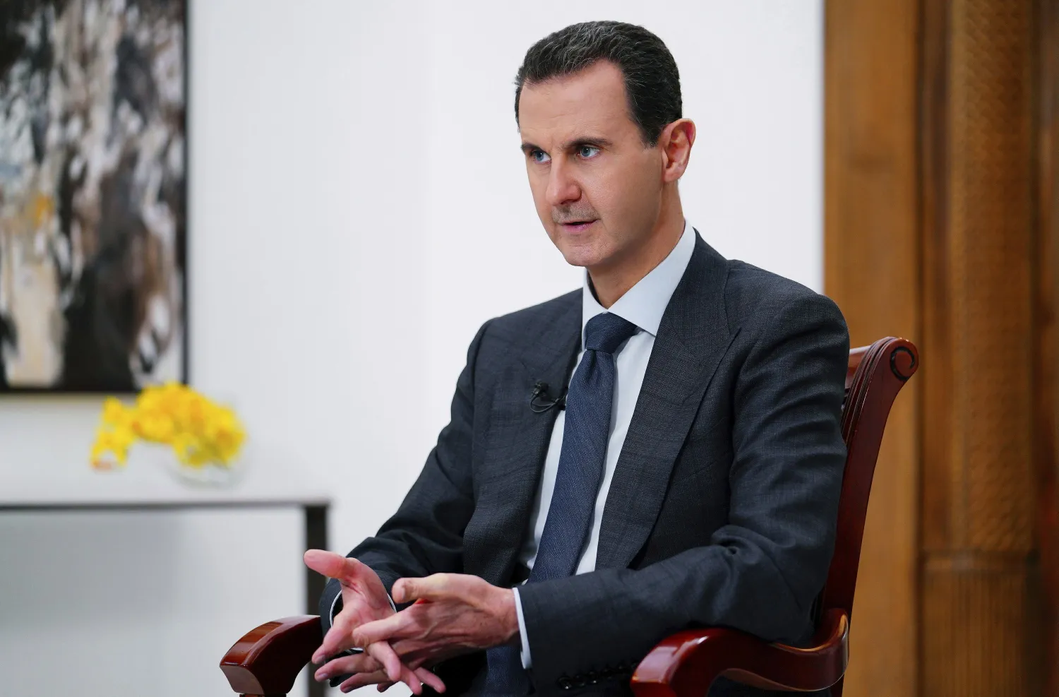 FILE - In this file photo released Monday Nov. 9, 2019 by the Syrian official news agency SANA, Syrian President Bashar Assad speaks in Damascus, Syria. Assad has his prime minister Thursday, June 11, 2020, a month ahead of elections as country's economic crisis worsens.(SANA via AP, File)
