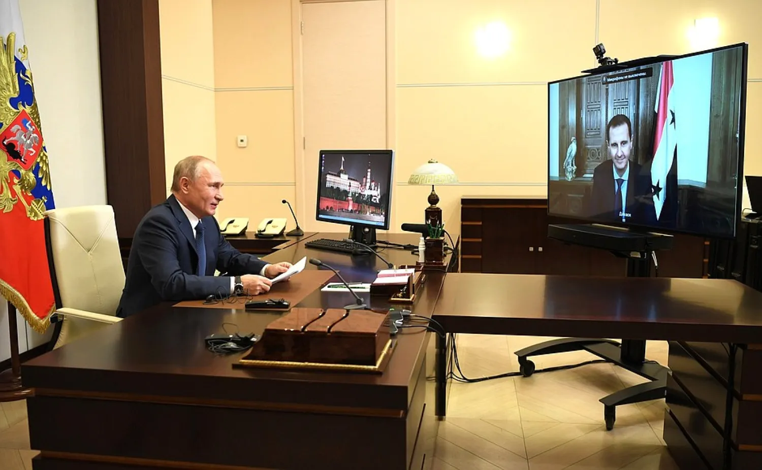 Russian President Vladimir Putin speaks with Syrian President Bashar al-Assad via a video conference. Russian Presidency