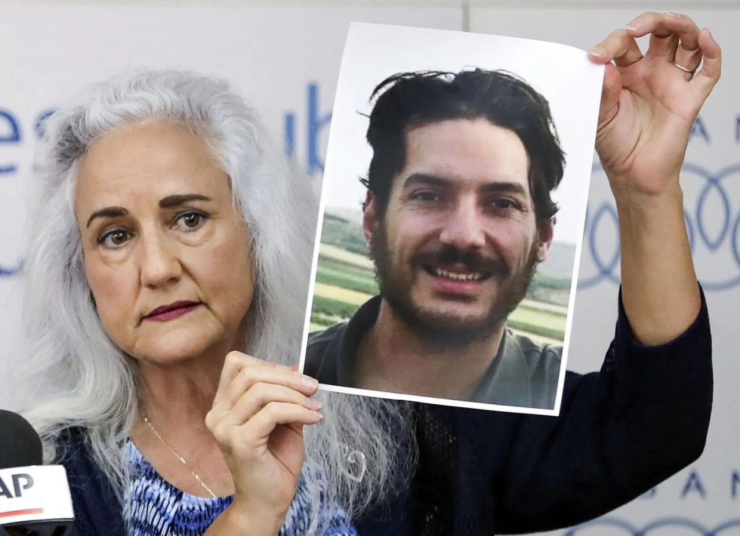 Debra Tice, mother of US journalist Austin Tice, holds a dated portrait of him during a news conference in the Lebanese capital Beirut on July 20, 2017. (Getty Images)